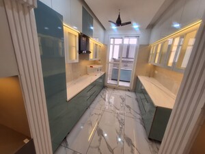 Kitchen in 4 BHK Apartment at Green Valley Heights, Dhakoli – for Sale