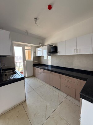 Kitchen in 4 BHK Apartment at Rishita Manhattan, Gomti Nagar – for Sale