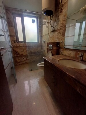 Bathroom in 3 BHK Builder Floor at Pamposh Enclave – for Rent