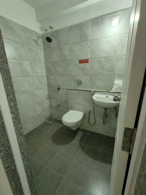Bathroom in 3 BHK Apartment at Goyal Orchid Valley, Shela – for Rent