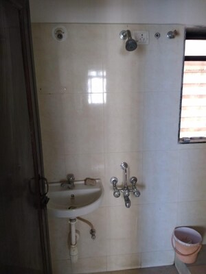 Bathroom in 2 BHK Apartment at Puranik City, Kasarvadavali – for Rent