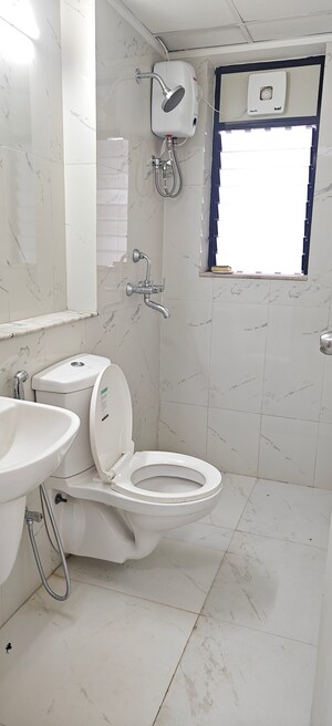 Bathroom in 1 BHK Apartment at Runwal Gardens, Dombivli East – for Rent