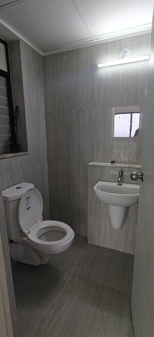 Bathroom in 1 BHK Apartment at Runwal Gardens, Dombivli East – for Rent