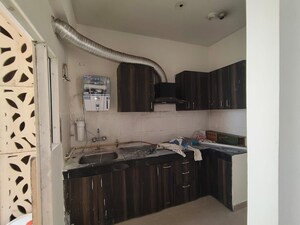 Kitchen in 2 BHK Apartment at Newtech La Palacia, Tech Zone 4 Greater Noida – for Rent