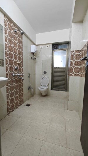 Bathroom in 2 BHK Apartment at DLH New Chandra CHS, Andheri West – for Sale