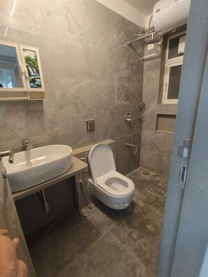 Bathroom in 1 BHK Apartment at Pratham 5TH Element, Andheri West – for Rent