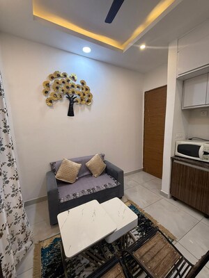 Living Room in Studio Apartment at Supertech North Eye, Sector 74 – for Rent