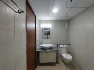 Bathroom in 2 BHK Apartment at Bhartiya Nikoo Homes Phase 2, Thanisandra Main Road – for Rent