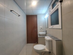 Bathroom in 2 BHK Apartment at Bhartiya Nikoo Homes Phase 2, Thanisandra Main Road – for Rent