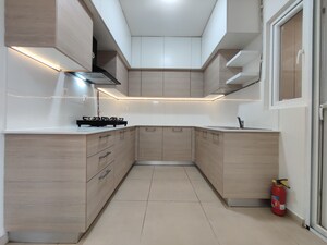Kitchen in 2 BHK Apartment at Bhartiya Nikoo Homes Phase 2, Thanisandra Main Road – for Rent