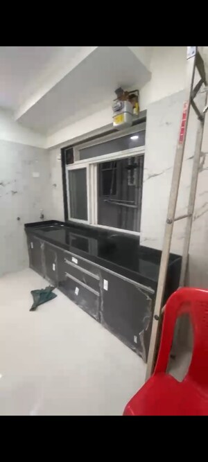 Kitchen in 2 BHK Apartment at Deraiya Iconico, Kurla East – for Rent