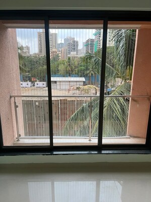 Balcony in 2 BHK Apartment at Dhariwal Siddharth Nagar Swami Vivekanand CHSL, Goregaon West – for Rent