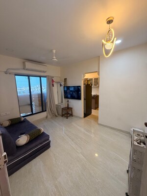 Living Room in 1.5 BHK Apartment at Chandiwala Pearl Heaven, Andheri East – for Sale