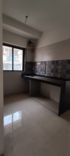 Kitchen in 1 BHK Apartment at Vaibhav Wisteria Residency, Santacruz East – for Rent