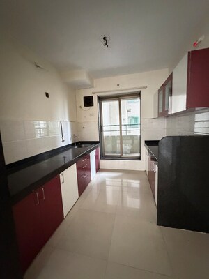 Kitchen in 3 BHK Apartment at Neelkanth Greens, Manpada – for Rent