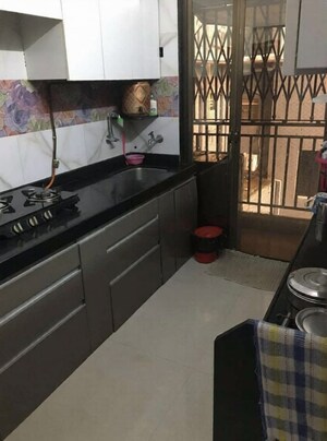 Kitchen in 2 BHK Apartment at Shreeji Apartment Kandivali, Kandivali West – for Rent