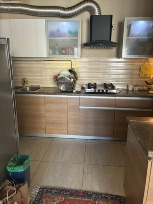 Kitchen in 3.5 BHK Apartment at ABA Cleo County, Sector 121 – for Rent