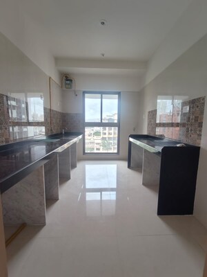 Kitchen in 3 BHK Apartment at Raj Infinia, Malad West – for Rent