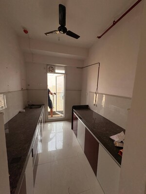 Kitchen in 2 BHK Apartment at Sitar Lokpuram CHS, Vasant Vihar – for Sale