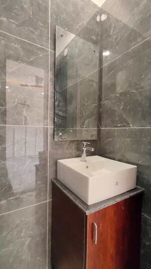 Bathroom in 3 BHK Builder Floor at Ansal API Esencia, Sector 67 – for Rent