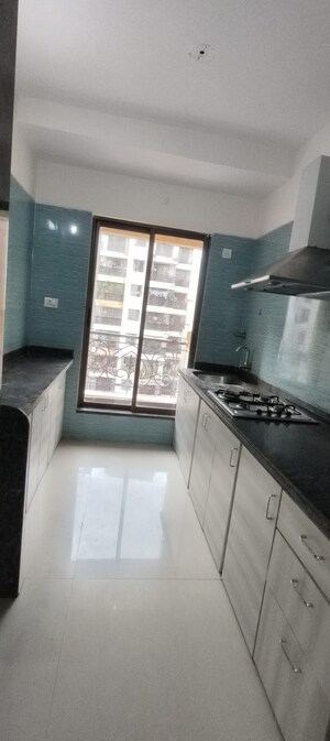 Kitchen in 2 BHK Apartment at Tharwani Rosewood Heights, Kharghar Sector 10 – for Rent