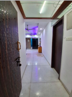Building Lobby in 2 BHK Apartment at Oshiwara Mhada, Andheri West – for Rent