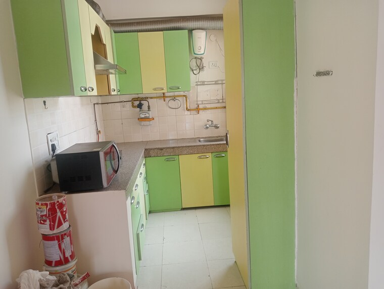 Kitchen, unitech-uniworld-gardens-2 3 Bedroom 1355 Sq.Ft. Apartment In Sector 47 Gurgaon 10646623