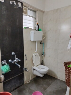 Bathroom in 3 BHK Apartment at Unique Poonam Estate Cluster 2, Mira Road – for Rent