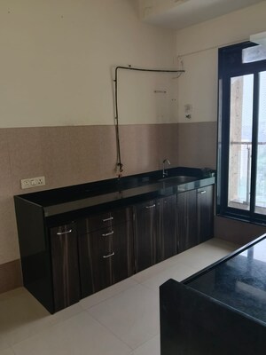 Kitchen in 2 BHK Apartment at Rustomjee Elanza, Malad West – for Rent