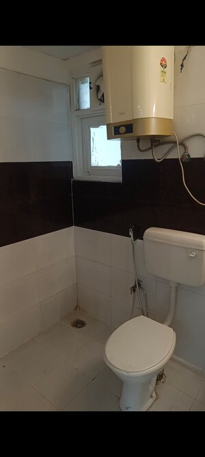Bathroom in 2 BHK Apartment at Raj Nagar Extension – for Sale