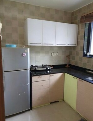 Kitchen in 1 BHK Apartment at Nandini CHS, Andheri West – for Rent