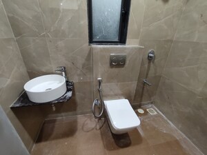 Bathroom in 1 BHK Apartment at Dhamji Shamji Mahavir Spring Tulip Phase 1, Pokhran Road No Two – for Rent