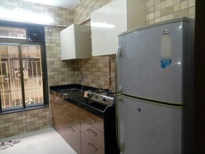 Kitchen in 2 BHK Apartment at Hare Krishna CHS, Andheri East – for Rent