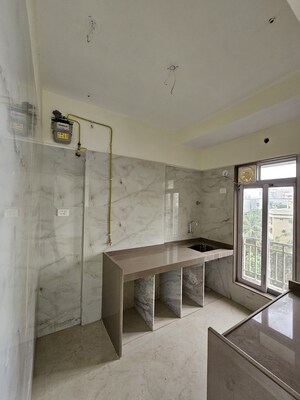 Kitchen in 2 BHK Apartment at Om Maruti Residency, Borivali West – for Sale