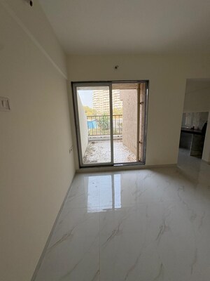 Living Room in 1 BHK Apartment at Metropolis Bayside, Kasarvadavali – for Rent