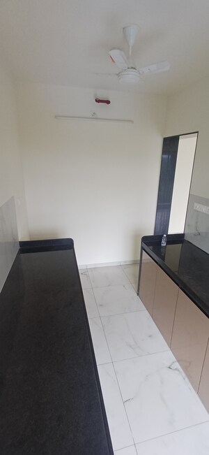 Kitchen in 2 BHK Apartment at MICL Aaradhya Parkwood, Mira Road – for Rent