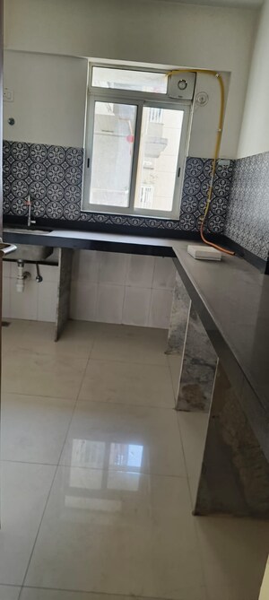 Kitchen in 1 BHK Apartment at Lodha Quality Home Tower 2, Majiwada – for Rent