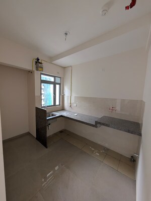 Kitchen in 3 BHK Apartment at Dosti Tulip, Balkum Pada – for Rent