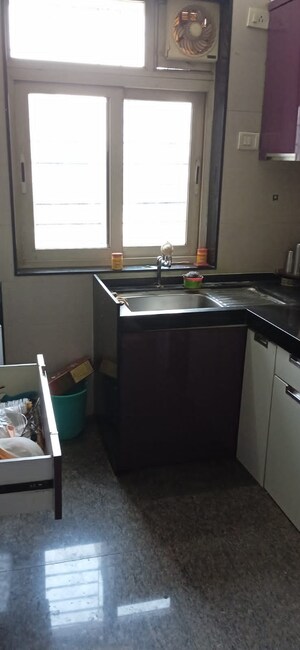 Kitchen in 2 BHK Apartment at Divya Stuti CHS, Goregaon East – for Rent