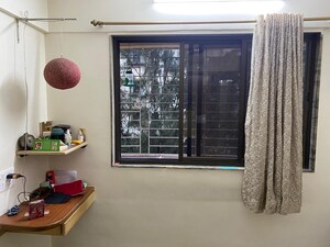 Living Room in 2 BHK Apartment at Ashoka Upvan CHS, Thane West – for Rent