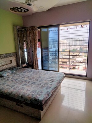 Bedroom in 2 BHK Apartment at Lokhandwala Highland, Kandivali East – for Rent