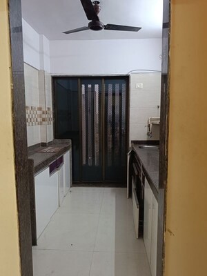 Kitchen in 2 BHK Apartment at Parikh Paradise Tower, Virar West – for Sale