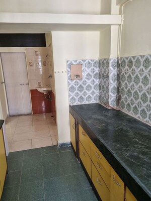 Kitchen in 2 BHK Apartment at Green Acres Apartment, Waghbil – for Rent