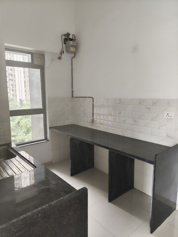 Kitchen in 2 BHK Apartment at Unnathi Woods Phase 3, Ghodbunder Road – for Rent