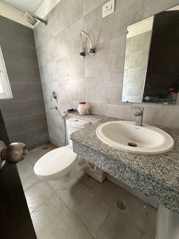 Bathroom in 2 BHK Apartment at Mahagun Mirabella, Sector 79 – for Rent