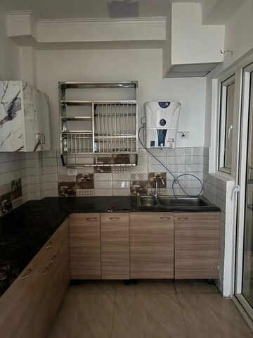 Kitchen in 2 BHK Apartment at Gaur Yamuna City 16th Park View, Gaur Yamuna City – for Rent