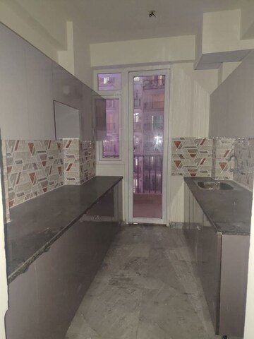 Kitchen in 3 BHK Apartment at DPL Flora Heritage, Sector 1 Greater Noida – for Rent