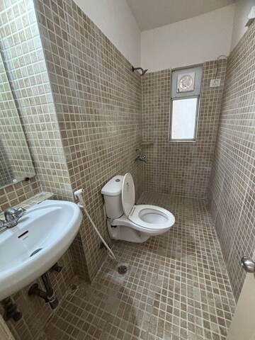 Bathroom in 4 BHK Apartment at Godrej Tropical Isle, Sector 146 – for Sale