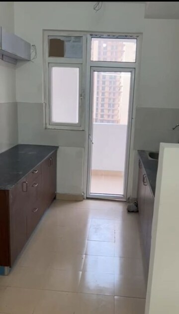Kitchen in 3 BHK Apartment at Amrapali Heartbeat City, Sector 107 – for Rent