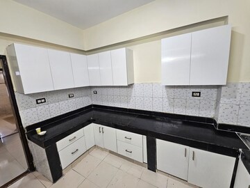 Kitchen in 4 BHK Apartment at AWHO Township Gurjinder Vihar, Omega Ii Greater Noida – for Rent